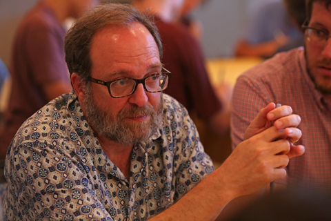 A participant shares with others at his table. (Photo by Stephen Salpukas)