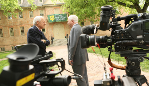 Bob Schieffer (left) interviews Robert Gates in front of the Wren Building. (Photo by Stephen Salpukas)