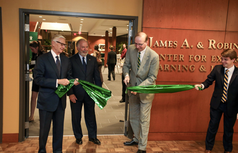 W&M President Emeritus Taylor Reveley, James A. Hixon J.D. '79, M.L.T. '80 and Dave Douglas each took a turn in cutting the ribbon at the dedication of the Hixon Center for Experiential Learning and Leadership on Feb. 8, 2017. (Photo by David Morrill)