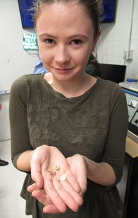 Grace Poreda '21 shows scale by holding the objects in her hand. (Photo by Joseph McClain)