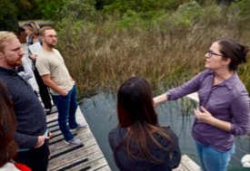 Mitchell (right) explains to students from the Virginia Coastal Policy Center how sea-level rise affects the management of marshes. (Photo by Aileen Devlin/Virginia Sea Grant)