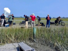 Verizon personnel and contractors test equipment to facilitate communications between the field, staging areas in Wachapreague, and the Incident Command Post in Melfa. (Photo by Sean Fate/VIMS ESL)