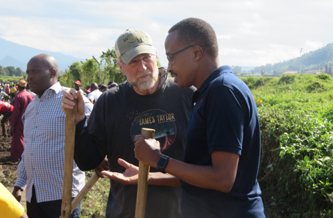 Spencer Niles talks with the Minister of Defense for Rwanda as part of the study-abroad program he led there this summer. (Photo courtesy of the School of Education)