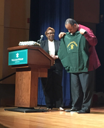 Martin receives a William & Mary sweatshirt from the event's organizers. (WYDaily/Courtesy Jo Rozycki '20)