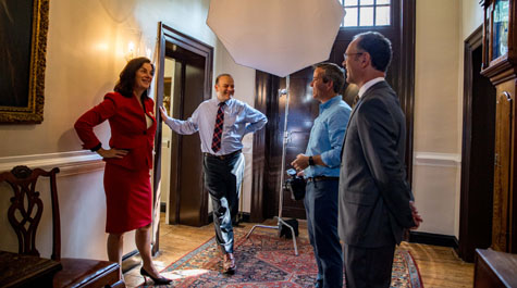 Rowe (left) shares a laugh with her husband, Bruce Jacobson (right), Chief Communications Officer Brian Whitson (second from left) and a photographer from the Wall Street Journal. (WYDaily/Courtesy Skip Rowland '83)