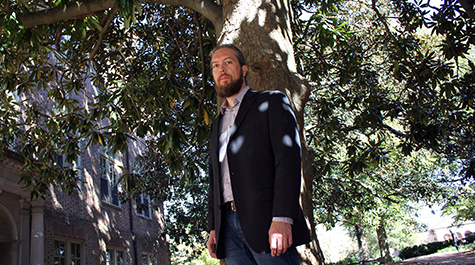 Nick Belluzzo poses under a magnolia tree on the William & Mary campus
