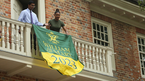 Students unfurl a Class of 2023 banner