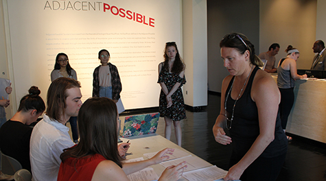 William & Mary neuroscientist Jennifer Stevens speaks with students before conducting a study of art museum visitors inside the Muscarelle 
