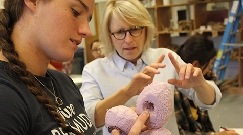 William & Mary art professor Elizabeth Mead discusses a model sculpture design with her student Saylor Zechman 
