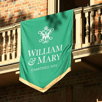 A William & Mary banner hangs from a balcony