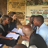 A William & Mary student speaking with smallholder farmers in rural Kenya.