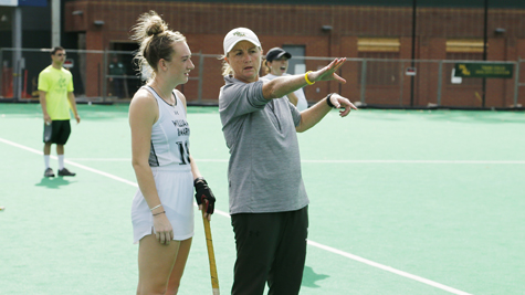 Field Hockey Coach Tess Ellis talks to a player. (W&M Athletics photo)