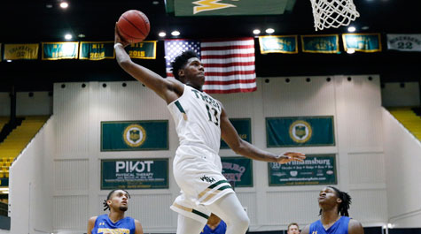 Nathan Knight flying through the air to dunk the basketball