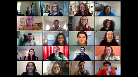 A screenshot of a Zoom call shows people in multiple boxes on a screen