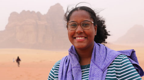 Dena Bashri with desert in Jordan in background