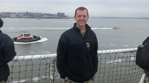 Scott Morris ’10 stands on the USNS Comfort as it floats into the New York harbor.Arriving in NY:
