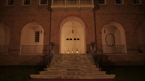 Wren Building with three lit lanterns at top of stairs