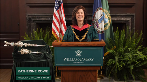 Katherine Rowe in academic regalia standing at a podium