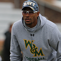 Michael London Jr. in W&M athletic wear and a Navy hat