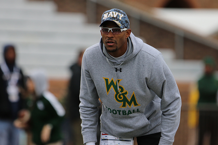 Michael London Jr. in W&M athletic wear and a Navy hat