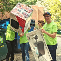 EdoReps students carrying items on freshman move-in day