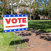 "vote" sign in front of voting center