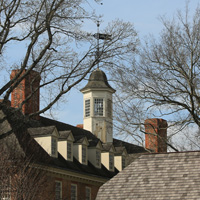 The cupola of the Wren Building is seen through trees