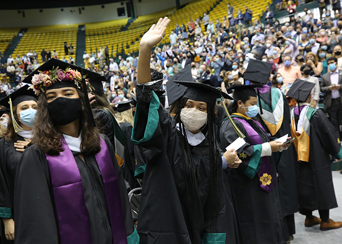 Graduates from the Class of 2020 celebrated at an in-person ceremony in Kaplan Arena on Sunday. (Photo by Stephen Salpukas)