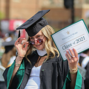 A graduate poses for a photo at one of the ceremonies. (Photo by Skip Rowland '83) 