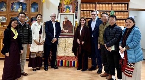 Dolma, on far left, and Professor Warren, fifth from left, met during Warren’s visit to the Tibetan Supreme Justice Commission in February 2020. They are pictured with members of the Commission. (Courtesy photo)
