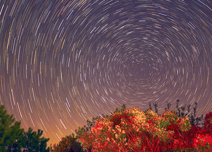 Circular star trails pictured over College Creek (Photo by Tyler Hutchison)