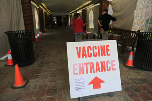 A sign at the front of the Greater Williamsburg Clinic shows people where to go. (Photo by Stephen Salpukas)