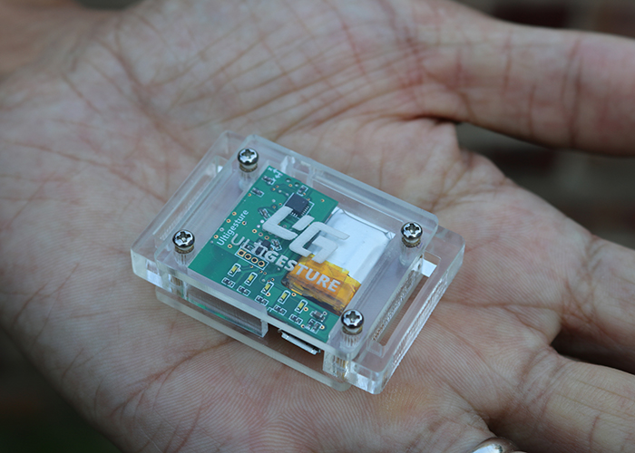 The UltiGesture is a quarter-sized piece of hardware co-developed by Zhou’s lab that carries an accelerometer and gyroscope that collect data, which is transmitted to a smartphone via Bluetooth. (Photo by Adrienne Berard)