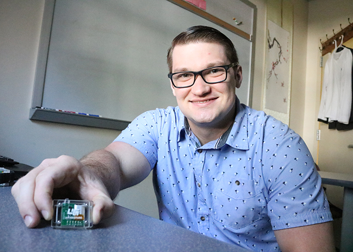 Ken Koltermann is a third-year Ph.D. candidate in computer science at William &amp; Mary. He is part of a team of researchers working to develop a novel treatment for a symptom of Parkinson’s disease called Freezing of Gait. (Photo by Adrienne Berard)