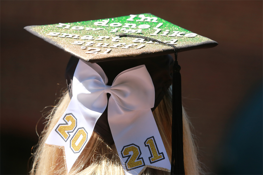 A mortarboard camp decorated with the words, I'm done, now I'm like smart and stuff '21 
