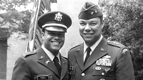 Black and white photo of two people in military uniform