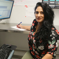 Tina Naik working at a computer