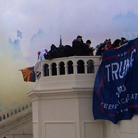 Tear gas and rioters in front of the U.S. Capitol building