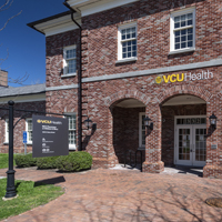 A brick building with a sign that says VCU Health