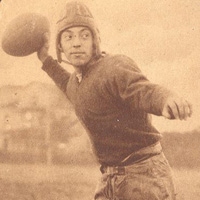 An old photo of a person getting ready to throw a football