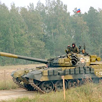 Russian military tank with soldiers on top