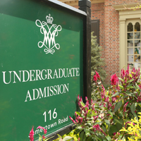 The undergraduate admission sign with the building in the background