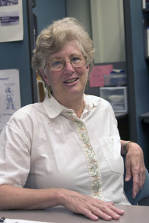 Zuber sits in the English department’s Writing Resource Center. By David WIlliard.