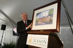 Miller receives a framed rendering of the building that will bear his name.