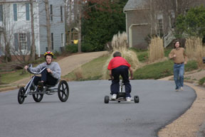 Oslterhout (r) tries to keep up with Michael (l) and his brother Zach (c). By Erin Zagursky.