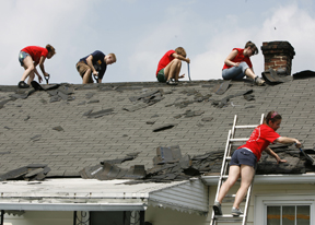 William and Mary students work at removing a roof at a home in Williamsburg as a part of the first annual Students Helping Out Williamsburg (SHOW) Day Tuesday. Photo by Stephen Salpukas