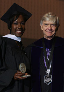 Harris receives the Sullivan Award from Interim President Reveley. By Stephen Salpukas.