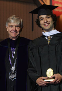 Loria receives the Sullivan Award from Interim President Reveley. By Stephen Salpukas.