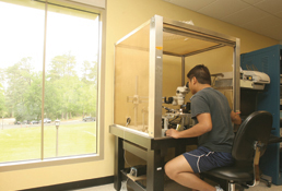 Karl Mendoza, a master’s student in biology, works on neural anatomy in the lab of John Griffin, Class of 2012 Associate Professor of Biology and director of the neuroscience program. The two are working to perfect a gold nanoprobe staining system designed by Mendoza. Adapting a probe used in cancer treatment, their aim is to develop a tool to label specific individual neurons. “The goal is that we’ll be able to go back and record from those cells, so we’ll be able to trace where they connect to and we’ll know their physiology,” Griffin said.