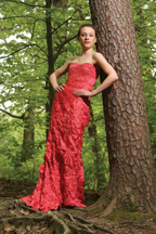 This strapless raspberry dress of champagne silk, modeled by psychology graduate student Kristin Reardon, ends with a glamorous train. Photo by Stephen Salpukas.  